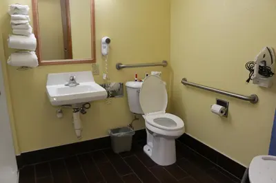 a bathroom with a toilet and a sink at Baymont by Wyndham Washington Court House in Jeffersonville