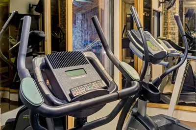 a row of exercise bikes in a gym at Baymont by Wyndham Washington Court House in Jeffersonville