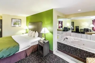 a hotel room with a bed and a bath tub at Quality Inn Decatur near US-224 in Decatur