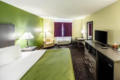 a hotel room with a large bed and a television at Quality Inn Decatur near US-224 in Decatur