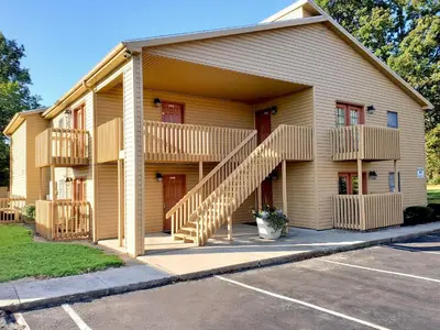 a building with stairs in front of a parking lot at Americas Best Value Inn St. Marys in Saint Marys