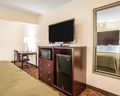 a hotel room with a bed and a flat screen tv at Quality Inn St Marys in Villa Nova