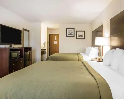 a hotel room with two beds and a flat screen tv at Quality Inn St Marys in Villa Nova