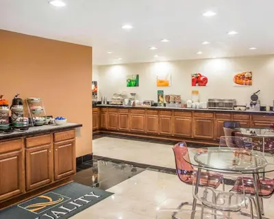 a restaurant with a table and a counter at Quality Inn St Marys in Villa Nova