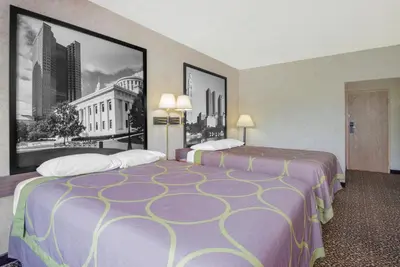 a hotel room with two beds and a large window at Super 8 by Wyndham Ashland in Ashland