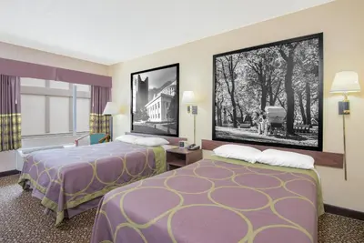 a hotel room with two beds and a window at Super 8 by Wyndham Ashland in Ashland