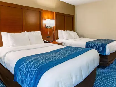 a hotel room with two beds with blue and white sheets at Comfort Inn Piketon near Fairgrounds in Piketon