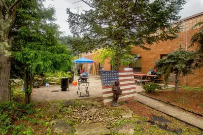 a sculpture of an american flag in a yard at Lafayette Inn in Moundsville