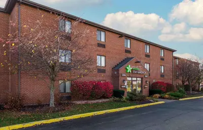 a red brick building with a sign on it at Extended Stay America Suites - Fort Wayne - North in Fort Wayne