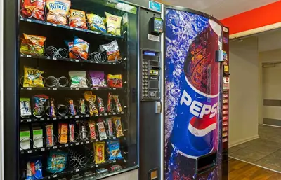 a soda vending machine filled with lots of snacks at Extended Stay America Suites - Fort Wayne - North in Fort Wayne