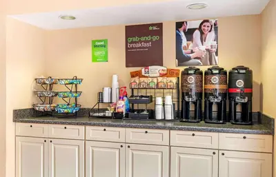 a counter with bottles of wine on top of it at Extended Stay America Suites - Cincinnati - Blue Ash - Reed Hartman in Blue Ash