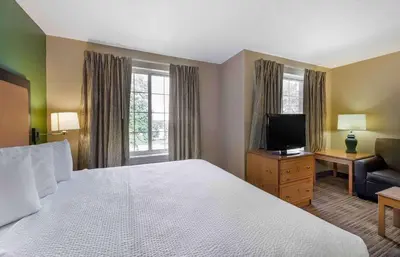 a hotel room with a bed and a television at Extended Stay America Suites - Cleveland - Airport - North Olmsted in North Olmsted
