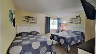 a bedroom with two beds and a window at Put-in-Bay Poolview Condo #2 in Put-in-Bay