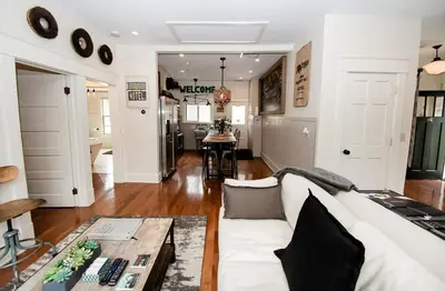 a living room with a white couch and a table at Studio 555 in Granville