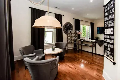 a living room with a table and chairs at Studio 555 in Granville