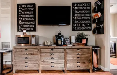 a wooden dresser with a microwave on top of it at The Loft in Granville