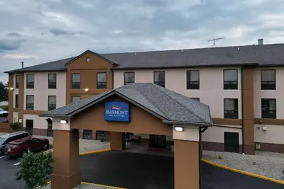 a hotel with a sign on the front of it at Baymont by Wyndham Mason in Mason