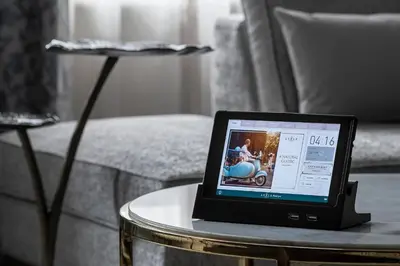 a laptop computer sitting on a table in a living room at The Lytle Park Hotel, Autograph Collection in Cincinnati