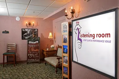 a meeting room with a sign in a room at OurGuest Inn & Suites Downtown Port Clinton in Port Clinton