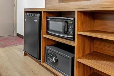 a kitchen with a microwave and a refrigerator at Red Roof Inn PLUS+ Columbus-Ohio State University OSU in Columbus