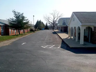 an empty street in a small town with houses at Walton Inn in Willard