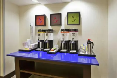 a table with a bunch of bottles on it at Hampton Inn & Suites - Elyria in Elyria