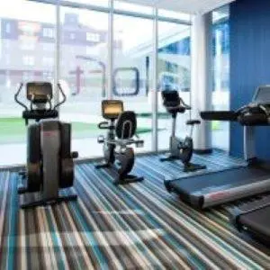 a gym with several exercise equipment in a room at Aloft Cleveland Downtown in Cleveland
