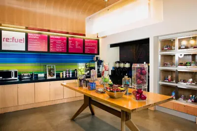a restaurant with a table with food on it at Aloft Cleveland Downtown in Cleveland