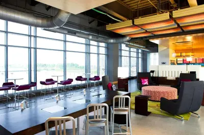 a conference room with a long table and chairs at Aloft Cleveland Downtown in Cleveland