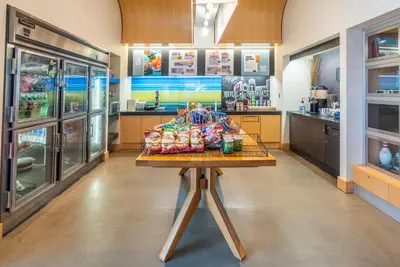 a kitchen with a table with bags on it at Aloft Cleveland Downtown in Cleveland