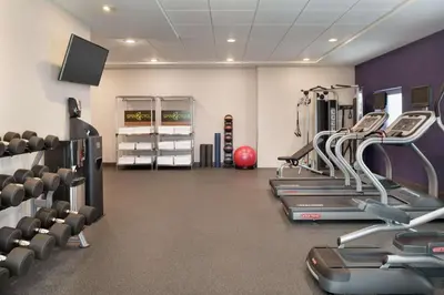 a fitness room with treadmills and cardio machines at Home2 Suites By Hilton Dayton/Beavercreek, Oh in Beavercreek