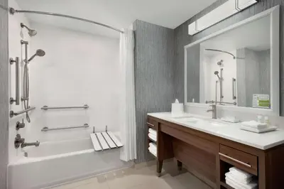 a bathroom with a tub and a sink at Home2 Suites By Hilton Dayton/Beavercreek, Oh in Beavercreek
