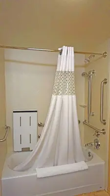 a shower curtain on the side of a bath tub at Hampton Inn Waynesburg in Waynesburg