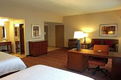 a hotel room with a bed and a desk at Hampton Inn Waynesburg in Waynesburg