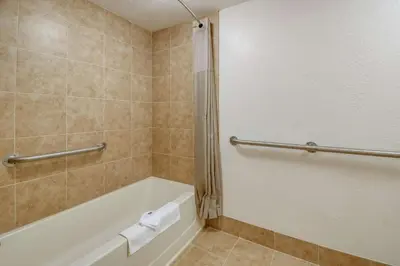 a bathroom with a tub and a shower stall at Motel 6-Grove City, OH in Grove City
