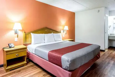 a hotel room with a bed and a window at Motel 6-Grove City, OH in Grove City