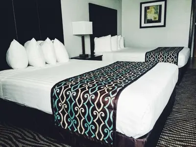 a hotel room with two beds with white sheets at Best Western Executive Inn- Mount Gilead in Pulaskiville