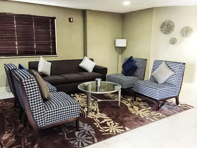 a living room with a couch and two chairs and a table at Best Western Executive Inn- Mount Gilead in Pulaskiville