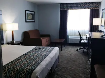 a hotel room with a bed and a couch at Best Western Executive Inn- Mount Gilead in Pulaskiville
