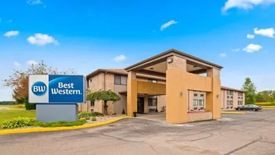 a best western sign in front of a building at Best Western Executive Inn- Mount Gilead in Pulaskiville