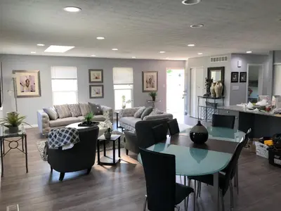 a living room with a table and a couch at Liberty House in Bethany