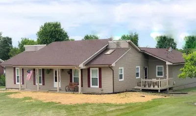 a house with a brown roof at Liberty House in Bethany