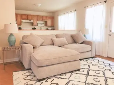 a living room with a couch and a chair at Landon's Attached Home in Monroe