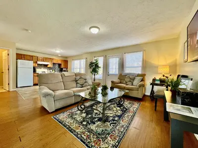 a living room with a couch and a table at Jason's Attached Home in Monroe