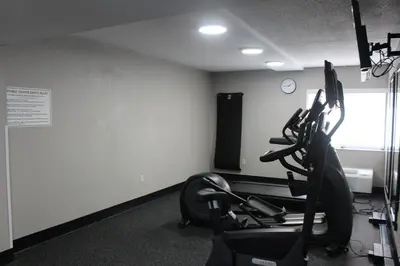 a gym with cardio equipment in a room at Country Inn & Suites by Radisson, Dunbar - Charleston in Dunbar