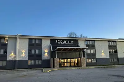 a building with a county sign on the front of it at Country Inn & Suites by Radisson, Dunbar - Charleston in Dunbar