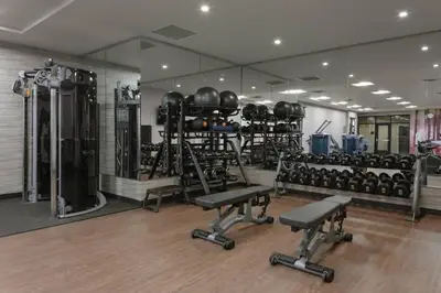 a gym with lots of equipment in a room at Courtyard Cincinnati Mason in Mason