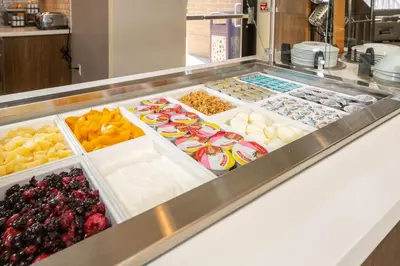 a display case filled with different types of food at Staybridge Suites Florence - Cincinnati South by IHG in Florence