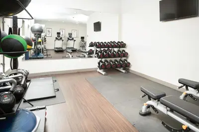 a gym with dumbbells and other equipment at Staybridge Suites Florence - Cincinnati South by IHG in Florence