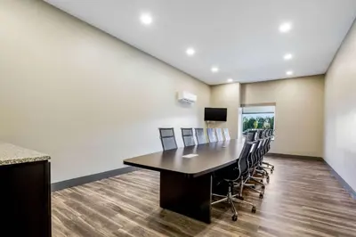 a conference room with a table and chairs at Sleep Inn Winfield - Teays Valley in Hurricane